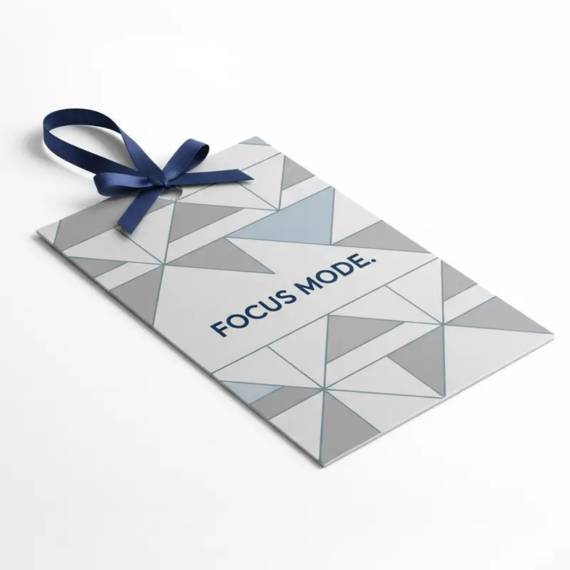 Cubicle workspace featuring minimalist hanging paper air freshener