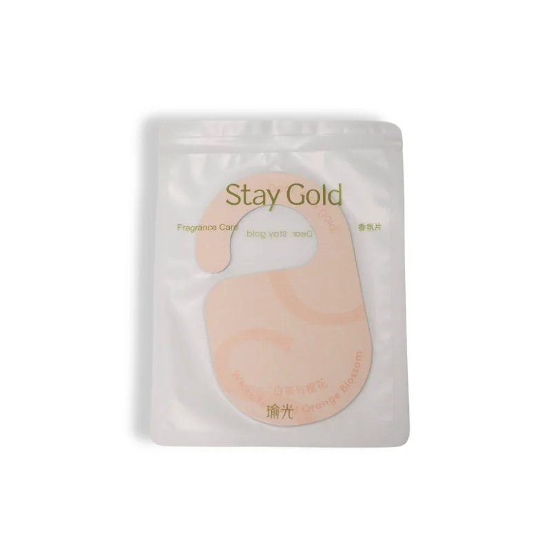 Sealed package of Stay Gold hotel fragrance door tag for guest rooms